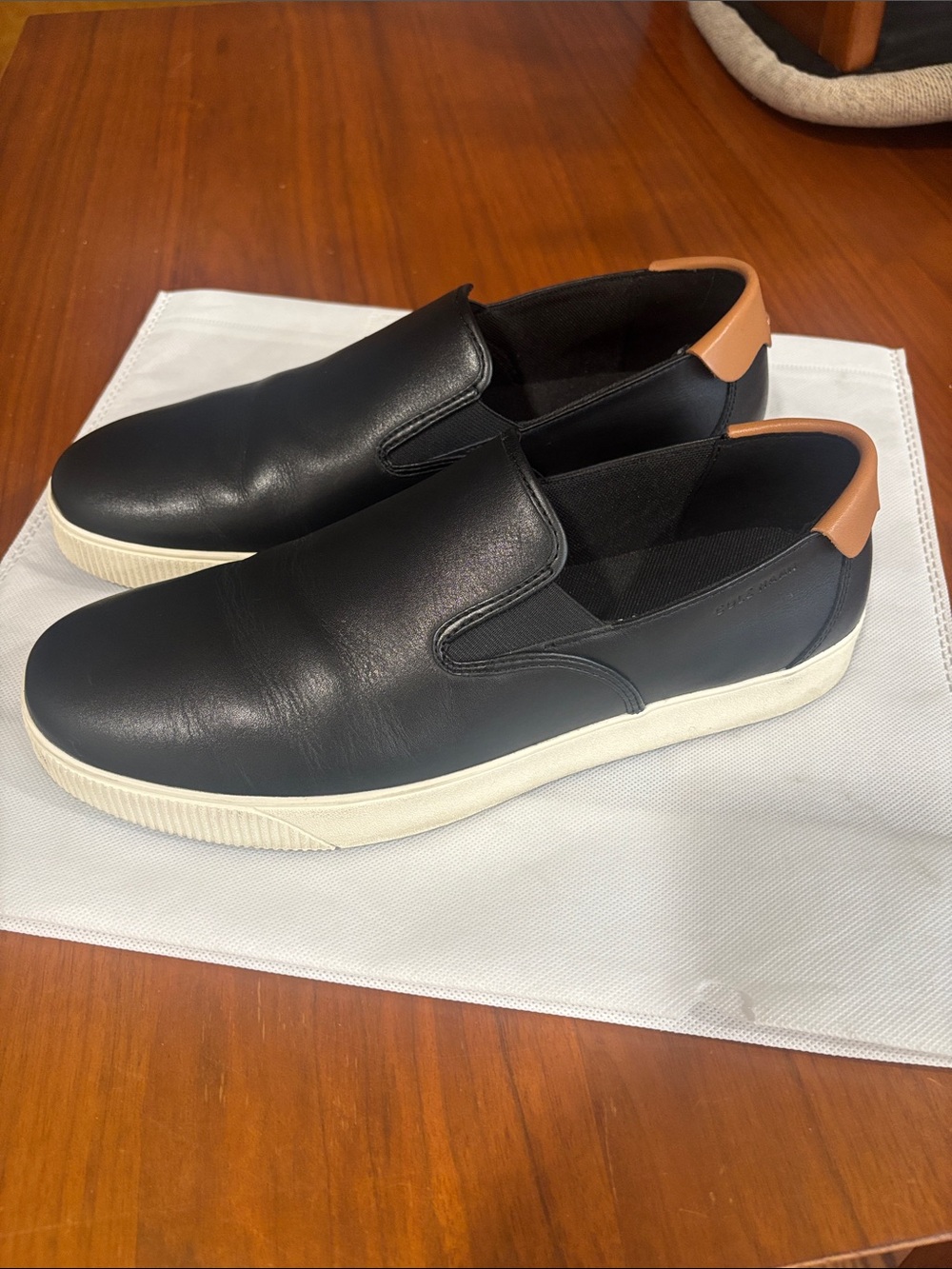 Cole Haan Black Leather Slip-On Sneakers with Tan Heel Tab